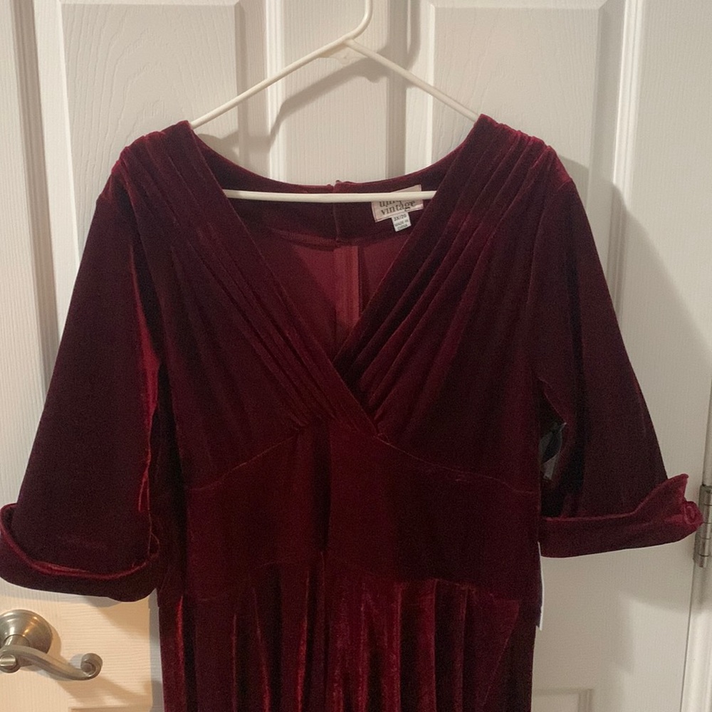 Burgundy Unique Vintage dress. New with tags and spare button.